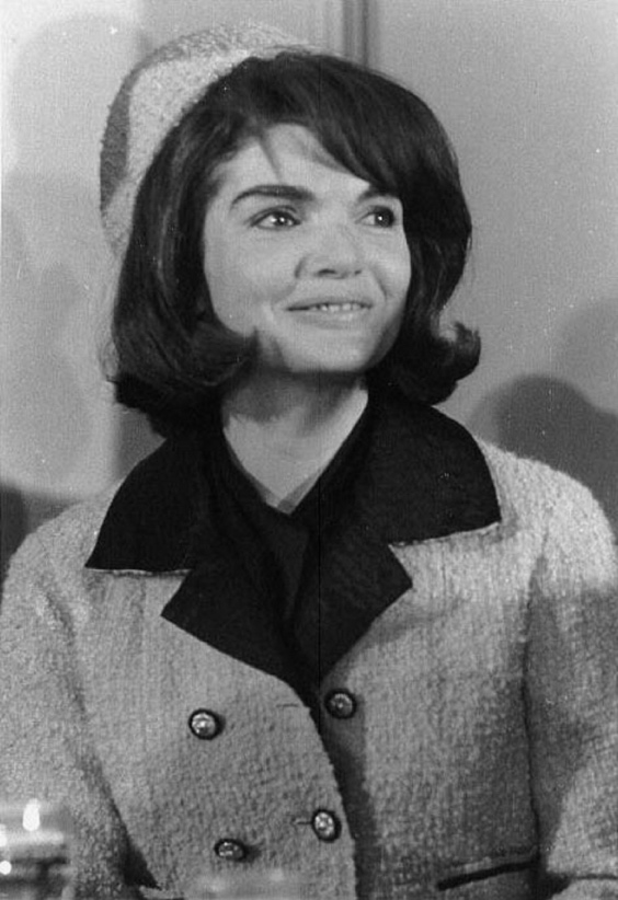 A Grayscale Snapshot of Jacqueline Kennedy in the Infamous Pink Suit